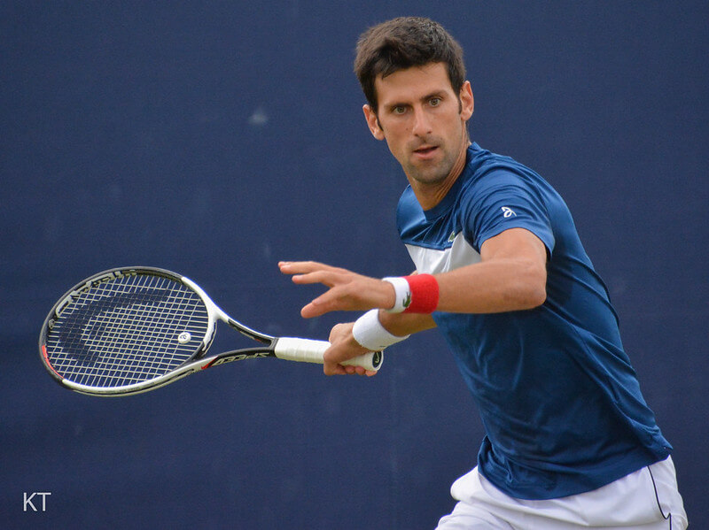 Novak Djokovic about to hit a ball with his racket